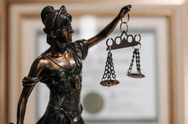 woman holding scales of justice