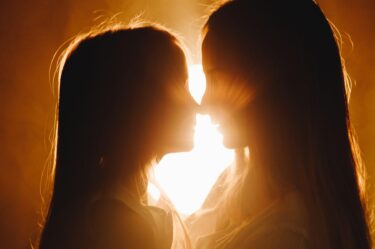 mother and daughter silhoutte nose to nose