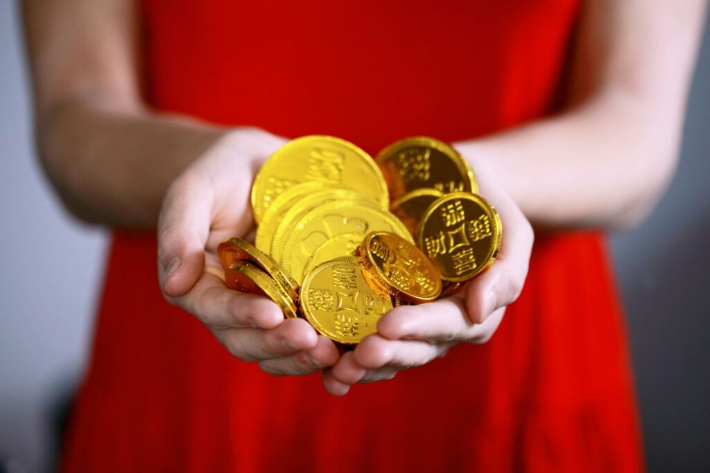 woman holding chinese new year coins