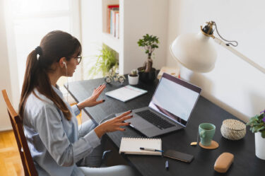 Woman in front of Laptop Working from home