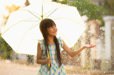 girl with umbrella during rainy season